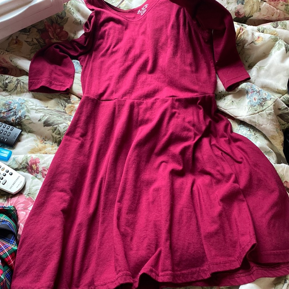 A burgundy open shoulder dress for a girl